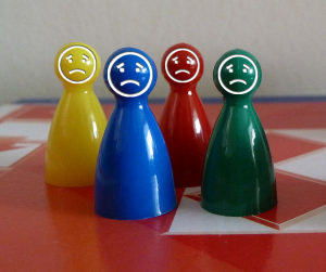 Sad game pieces on a gameboard